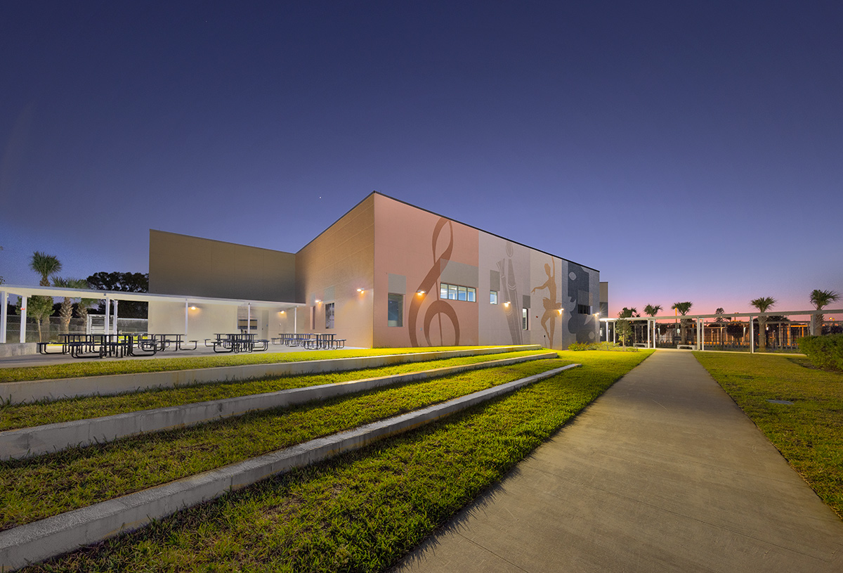 Architectural dusk view of the Plumosa School of the Arts in Delray Beach. FL.
